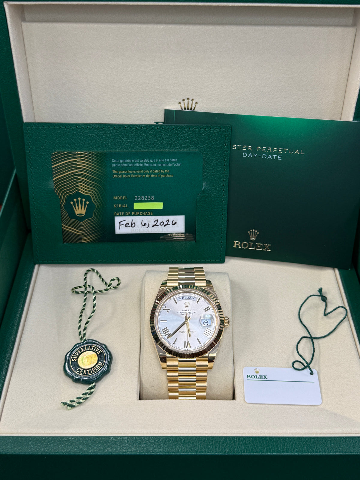 Rolex day date 40mm silver roman dial 18kt yellow gold   228238
